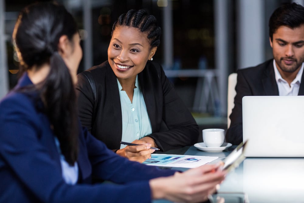 Businesswoman interacting with a colleague in the office